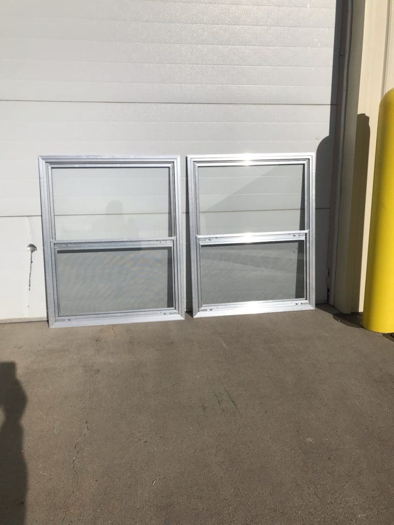 #17 2ea. 30.25 x 37.75 Mill Storm Windows
